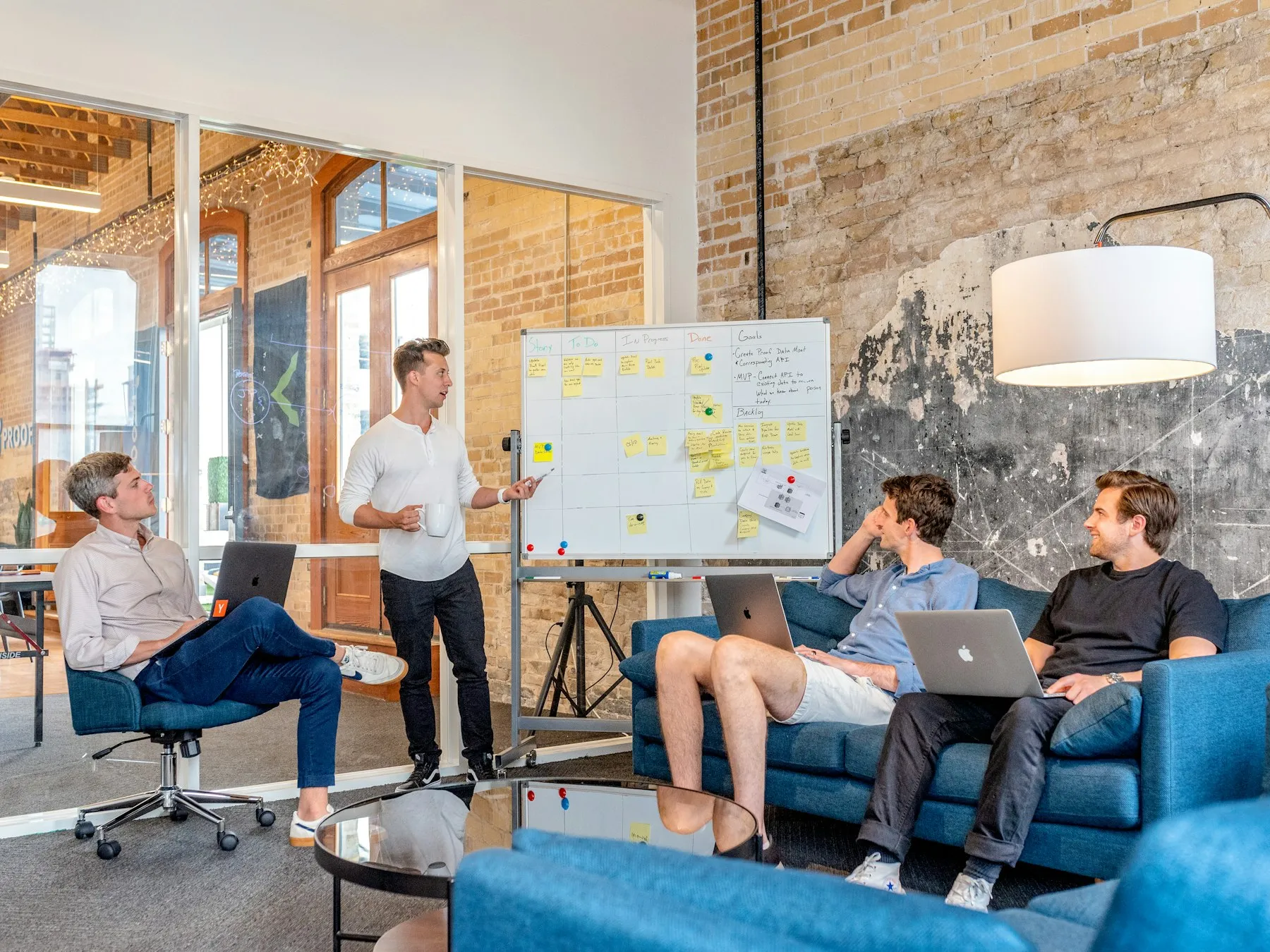 Team planning a project on a whiteboard